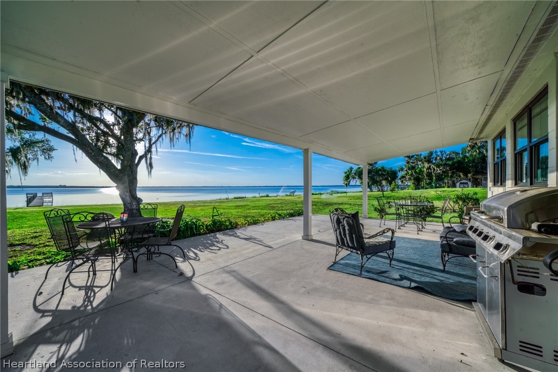 1843 South Lake Reedy Boulevard Frostproof, FL 33843 - Photo 10 of 50 a building outdoor space with patio furniture and potted plants