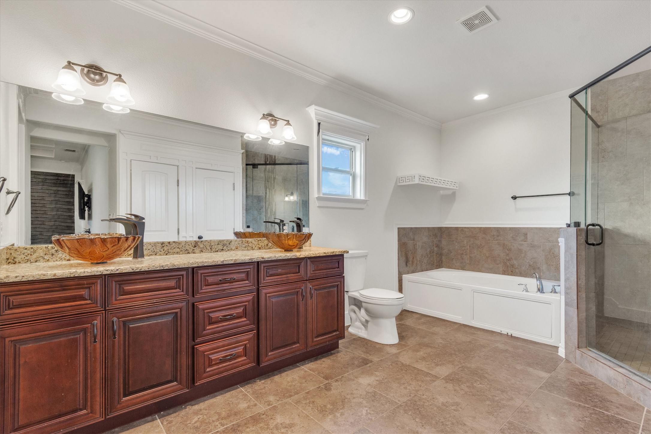 164 Peck Street Kyle, TX 78640 - Photo 11 of 19 Full bathroom featuring double vanity, a stall shower, crown molding, a bath, and recessed lighting