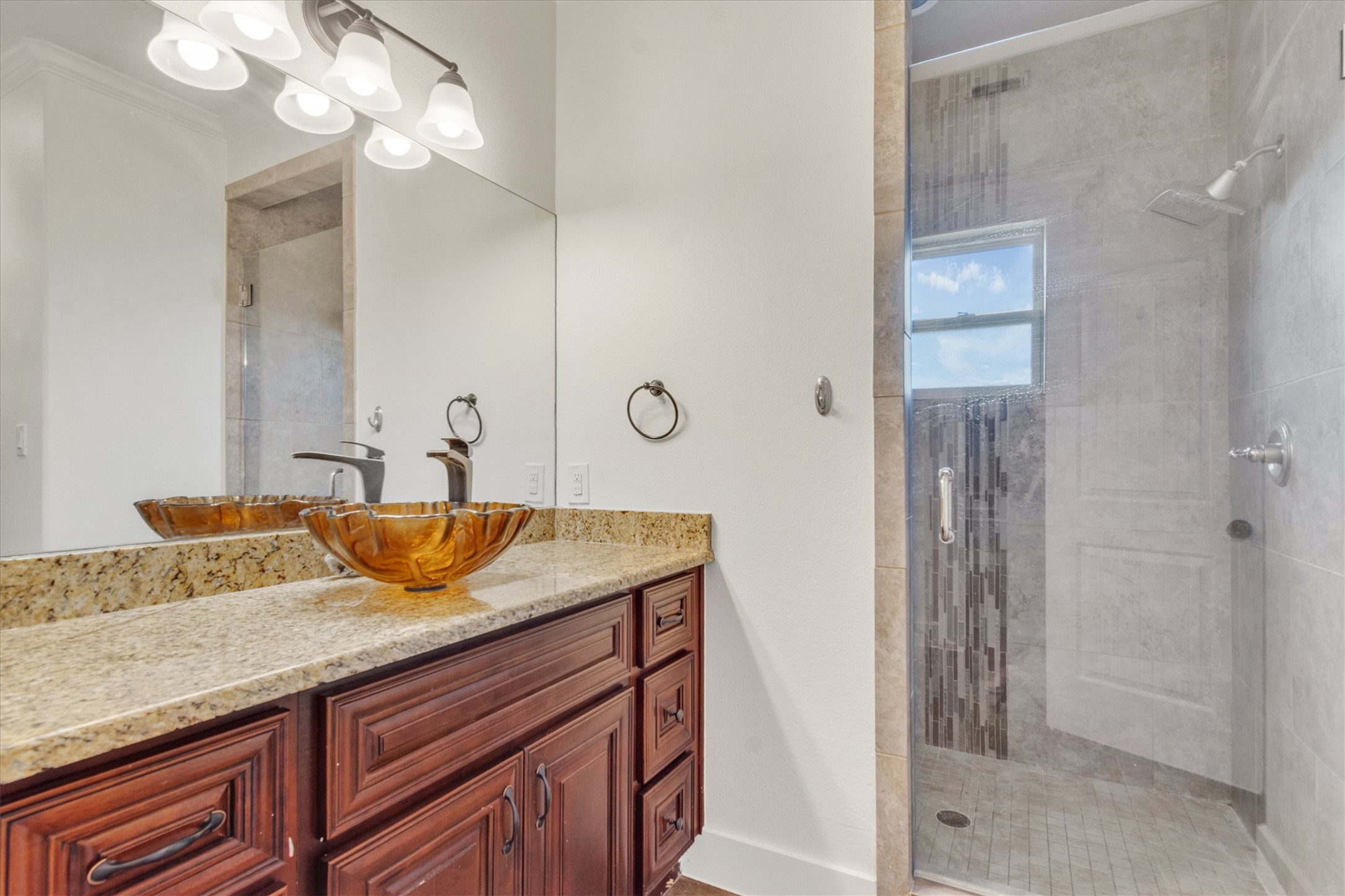164 Peck Street Kyle, TX 78640 - Photo 14 of 19 Bathroom featuring a stall shower and vanity