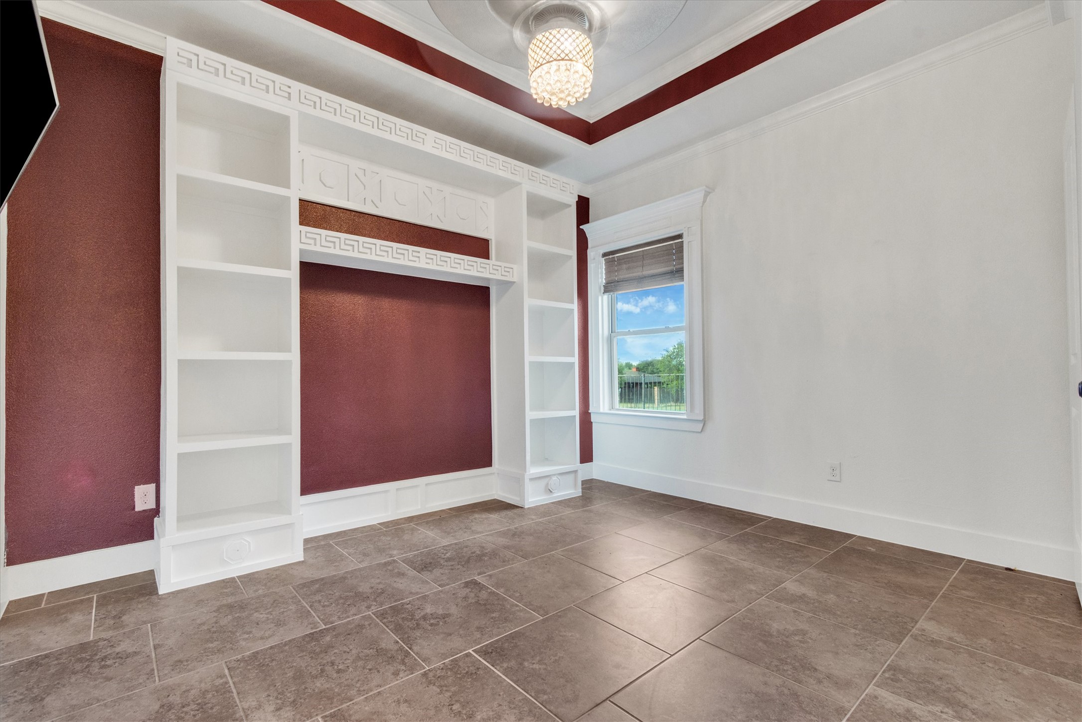 164 Peck Street Kyle, TX 78640 - Photo 15 of 19 Bedroom featuring a raised ceiling and crown molding