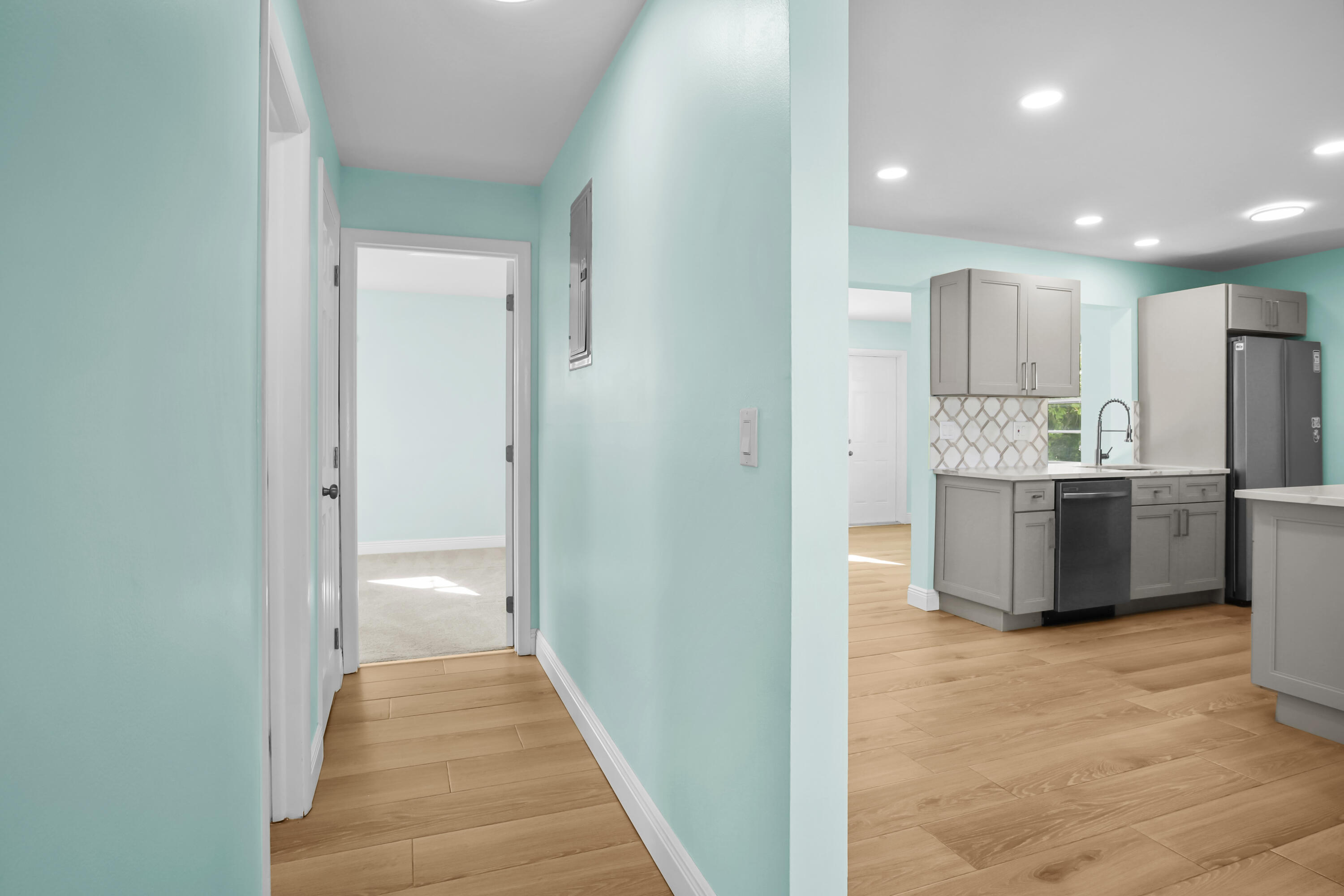 1308 Southwest 24th Street Boynton Beach, FL 33426 - Photo 13 of 19 a view of a kitchen from the hallway