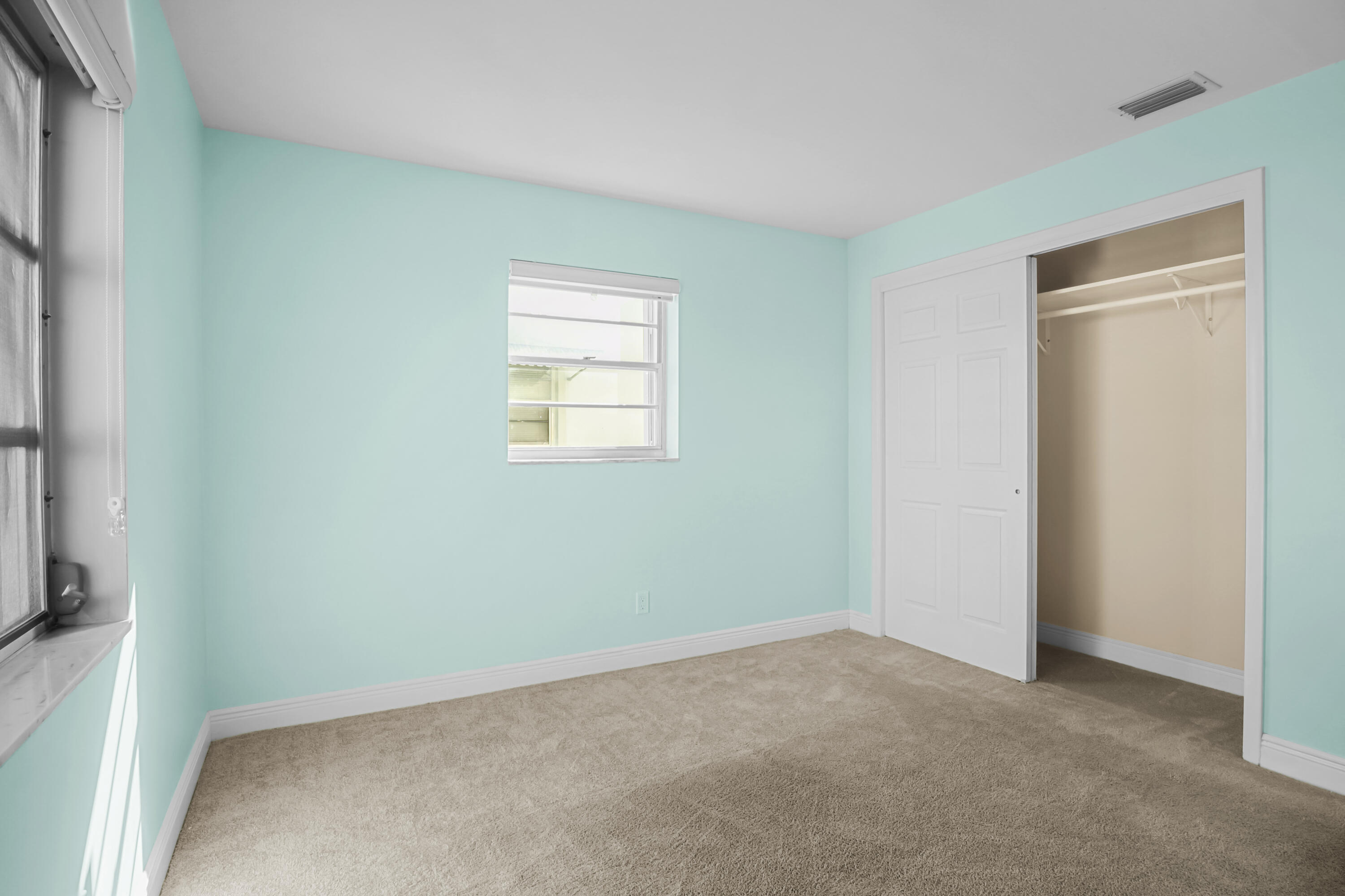 1308 Southwest 24th Street Boynton Beach, FL 33426 - Photo 15 of 19 a view of an empty room with a window