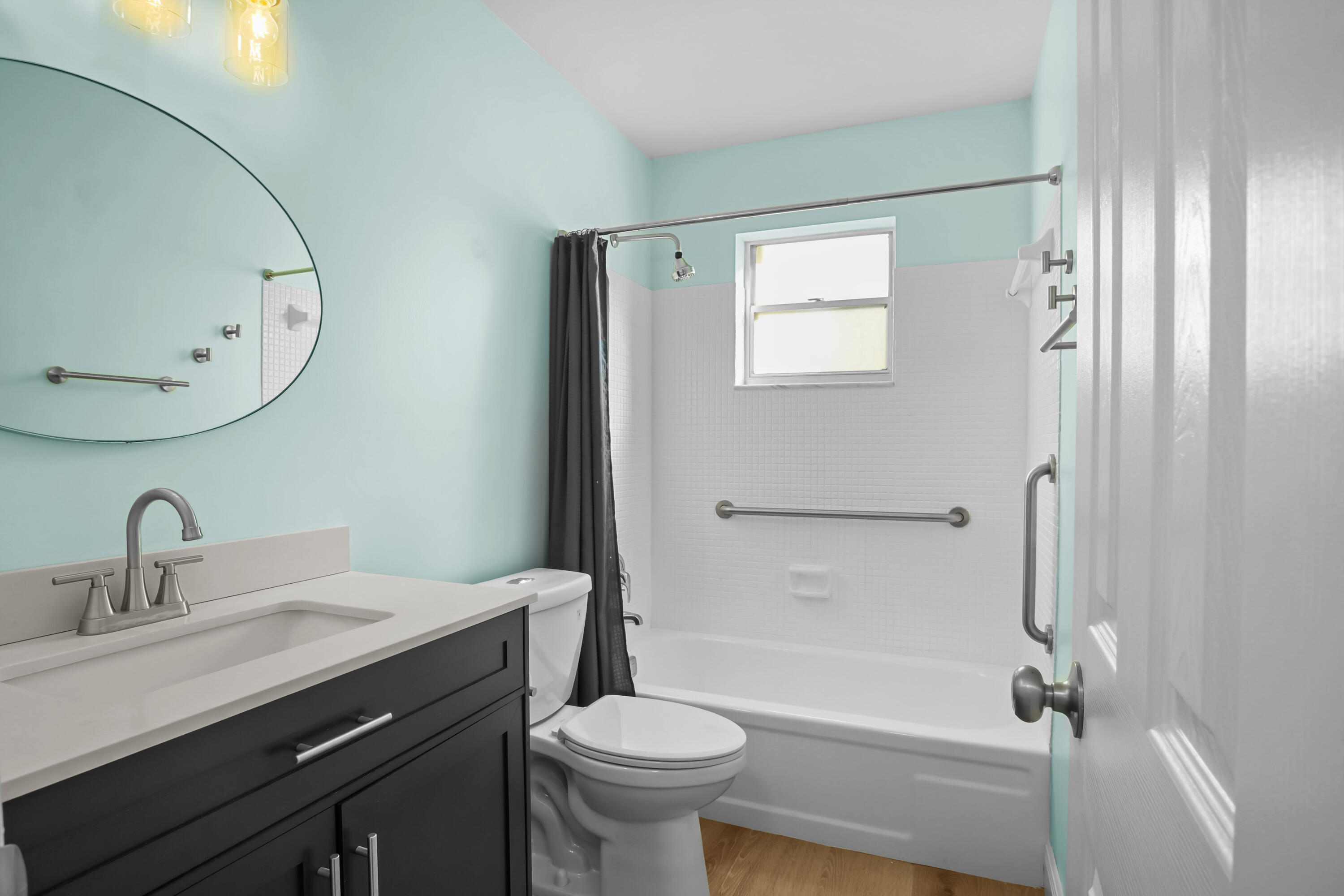 1308 Southwest 24th Street Boynton Beach, FL 33426 - Photo 18 of 19 a bathroom with a sink a toilet and shower