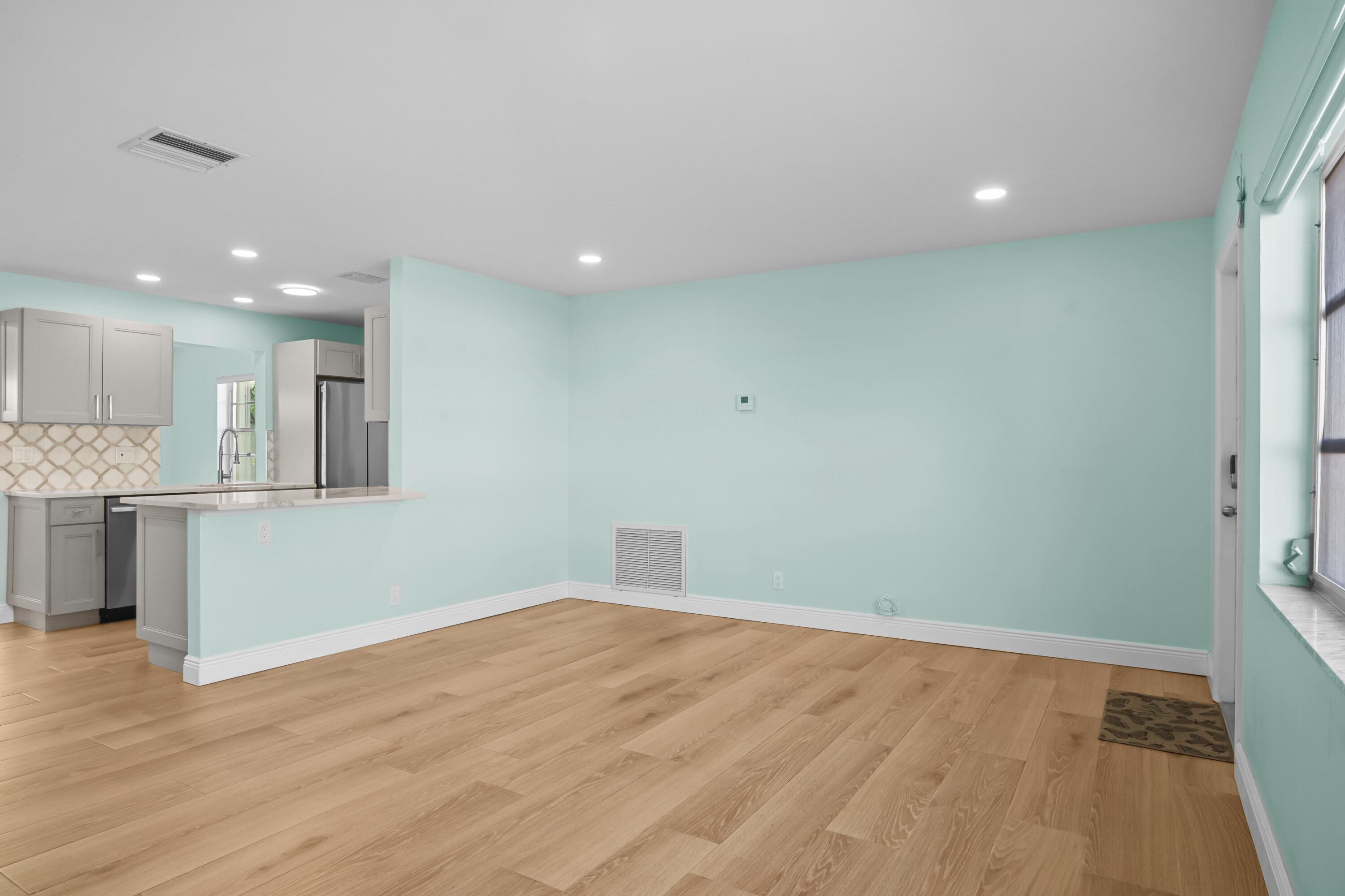 1308 Southwest 24th Street Boynton Beach, FL 33426 - Photo 10 of 19 a view of kitchen with wooden floor
