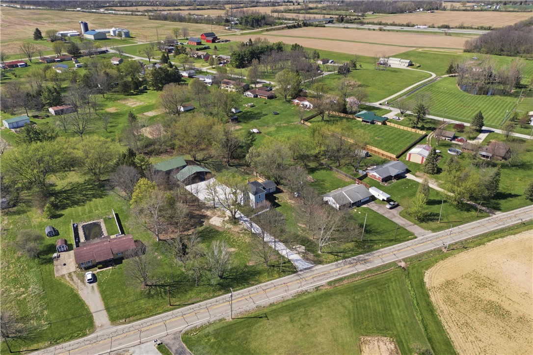 3190 Rebert Pike Springfield, OH 45502 - Photo 43 of 48 An expansive aerial perspective highlights a serene rural landscape with scattered homes and verdant fields.