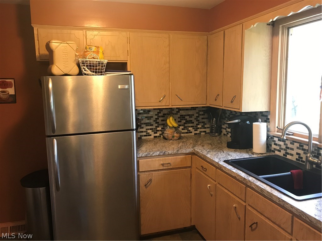 4721 5th Street Northwest Canton, OH 44708 - Photo 2 of 18 New Counter Tops and New Glass Tile Backsplash.