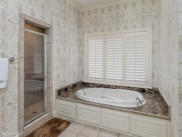 a bathroom with a granite countertop window and a shower