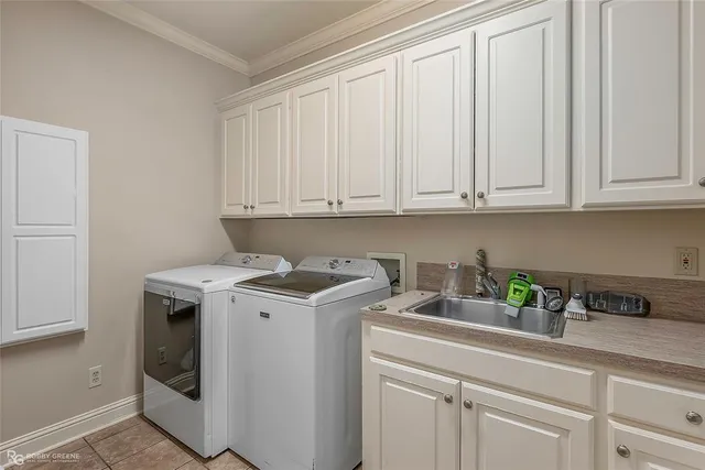 a view of a kitchen with sink and cabinets