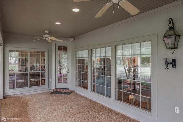a view of an empty room with windows