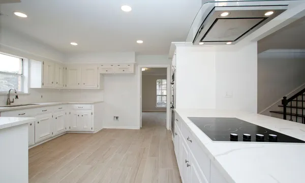 a kitchen with a sink a stove and refrigerator