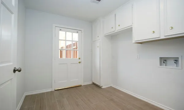 an empty room with cabinet