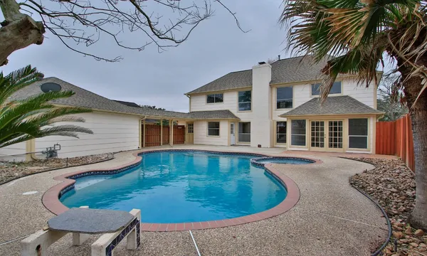 a view of a house with swimming pool