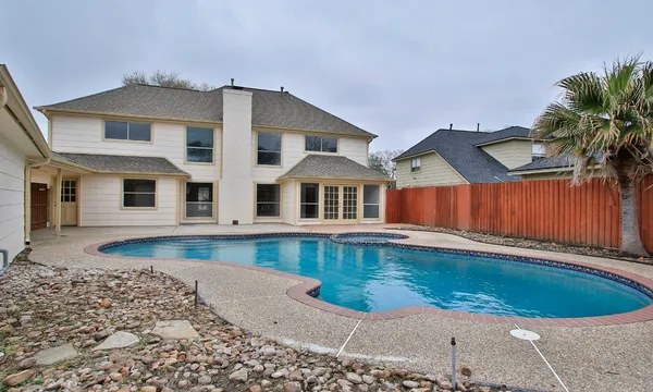 a front view of a house with swimming pool