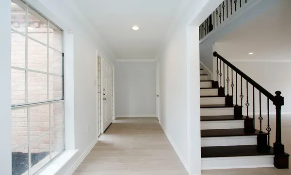 a view of entryway with wooden floor and stairs