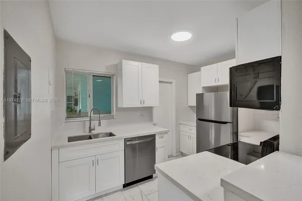 a kitchen with a stove and a microwave