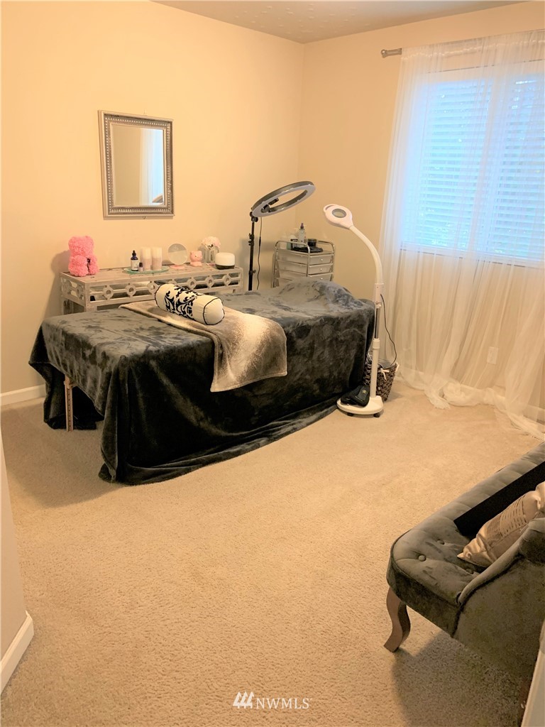 273 Graham Avenue Northeast Renton, WA 98059 - Photo 16 of 23 a bedroom with a bed and a couch