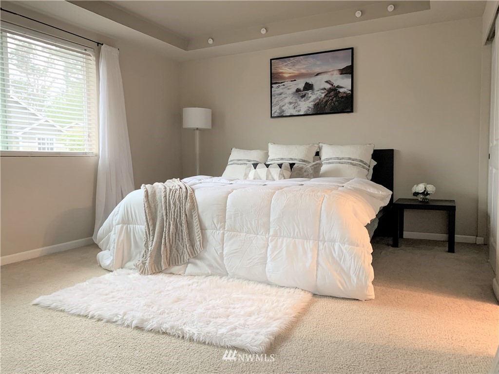 273 Graham Avenue Northeast Renton, WA 98059 - Photo 19 of 23 a bedroom with a bed and a painting