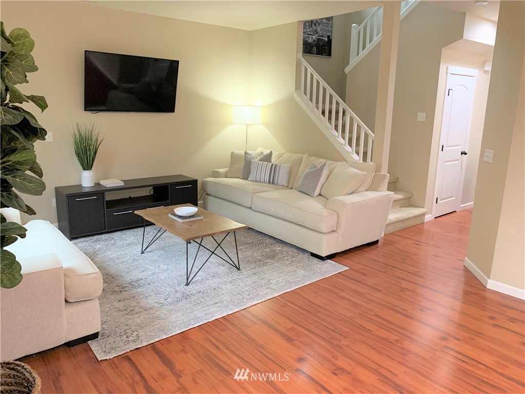 273 Graham Avenue Northeast Renton, WA 98059 - Photo 5 of 23 a living room with furniture and a flat screen tv