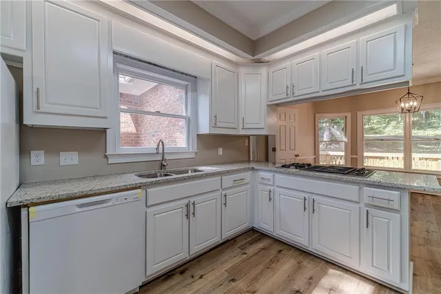 a kitchen with sink and window