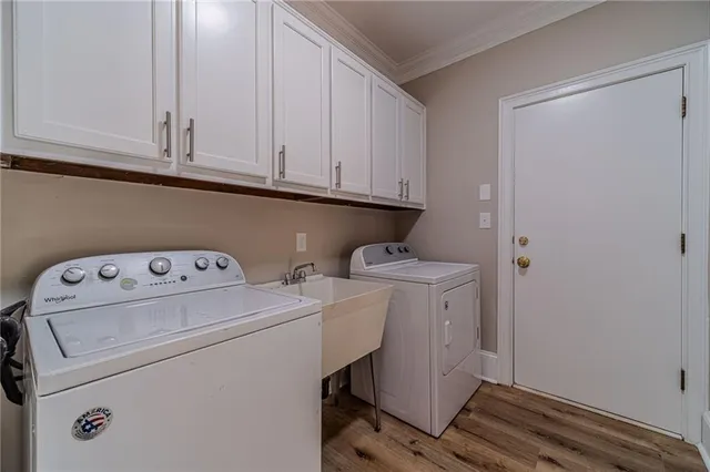 a view of storage and utility room with washer and dryer