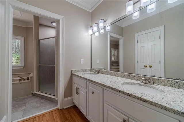 a white bath tub sitting in a bathroom next to a window