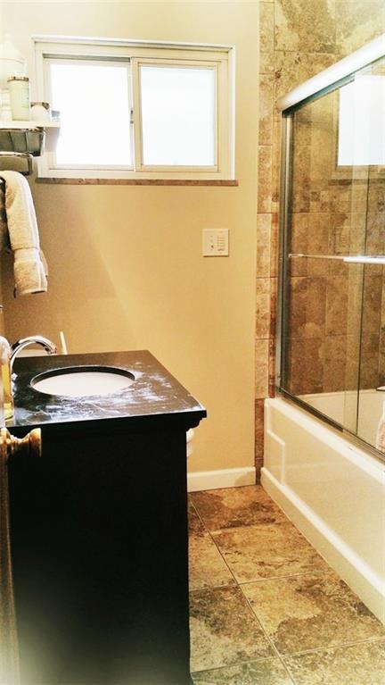 15 Winding Road Leetsdale, PA 15056 - Photo 10 of 18 One of the two new baths with dark stained cabinets, soaking tub and beautiful tile floor.