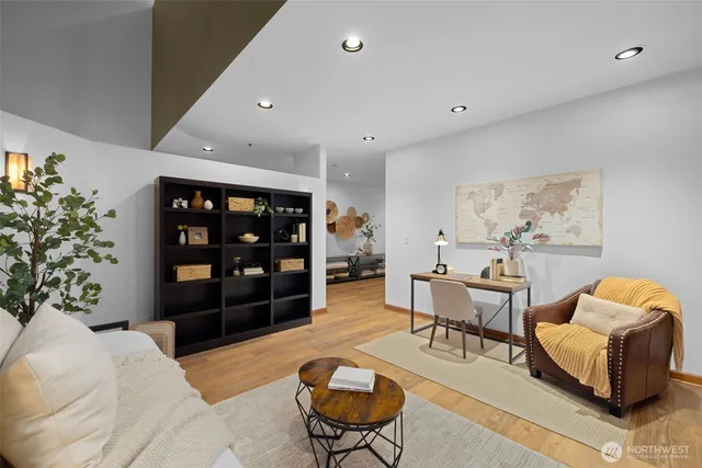 a living room with furniture and a potted plant