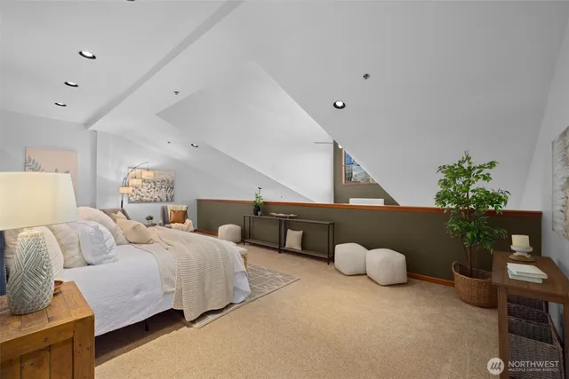 a bedroom with furniture and a potted plant