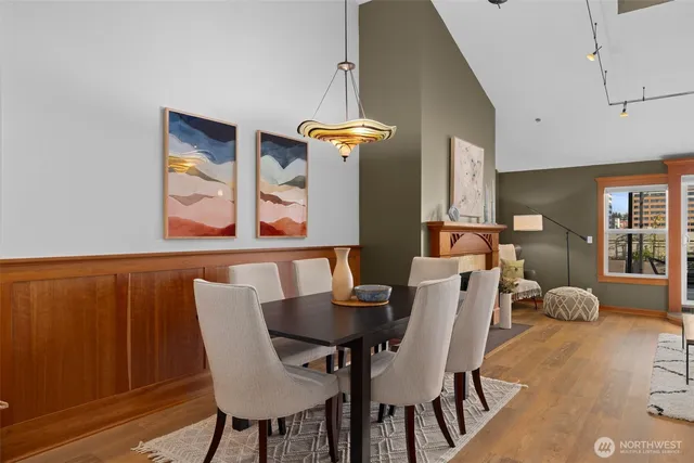 a view of a dining room with furniture and wooden floor