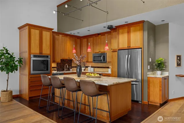 a dining table chairs and a refrigerator
