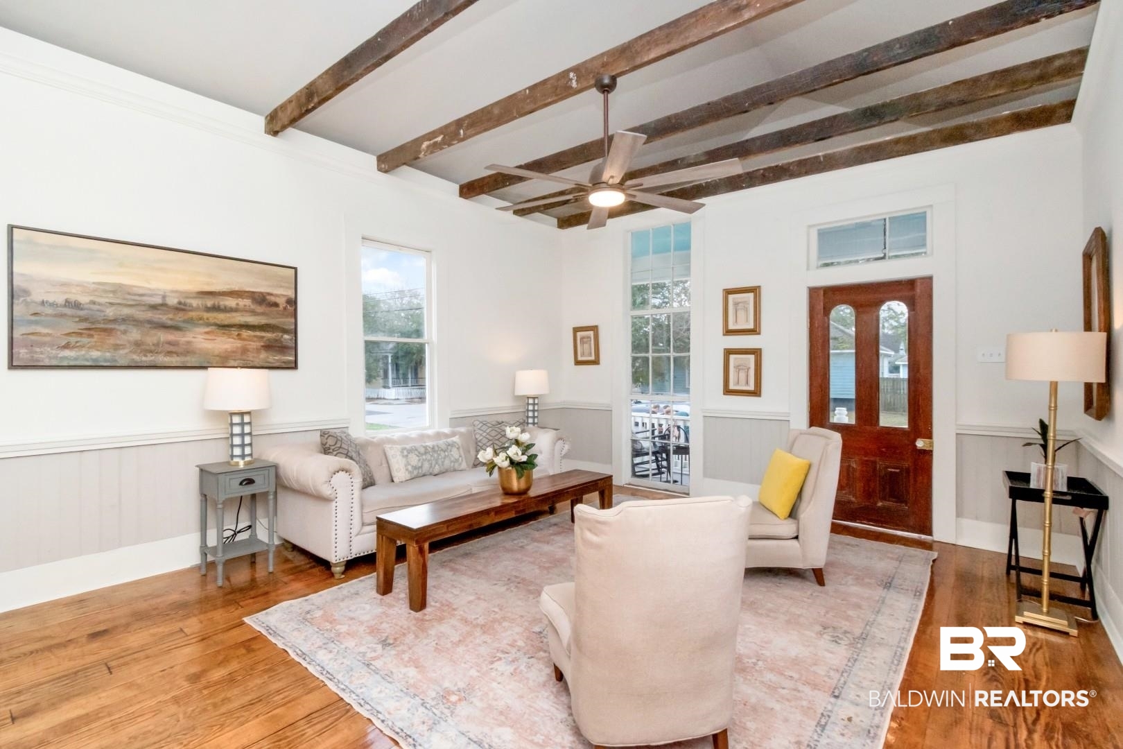 352 Marine Street Mobile, AL 36604 - Photo 3 of 20 Living room featuring a wainscoted wall, beamed ceiling, wood finished floors, and a ceiling fan