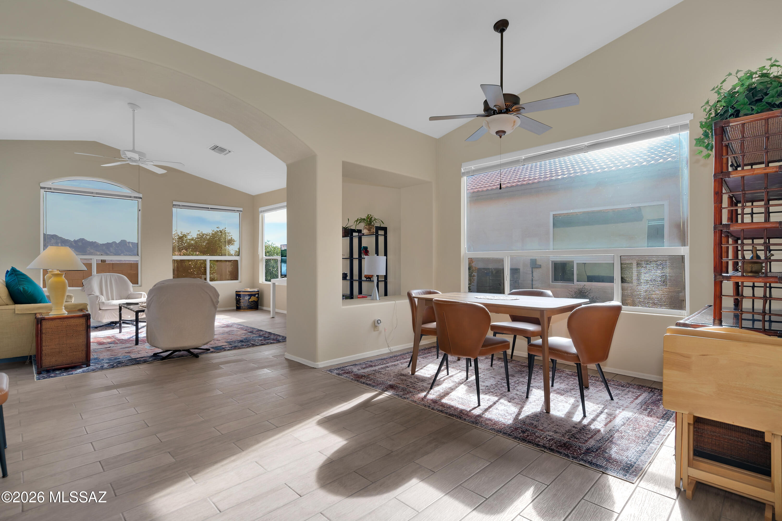 64351 East Wind Ridge Circle Tucson, AZ 85739 - Photo 5 of 41 a dining room with furniture window and wooden floor