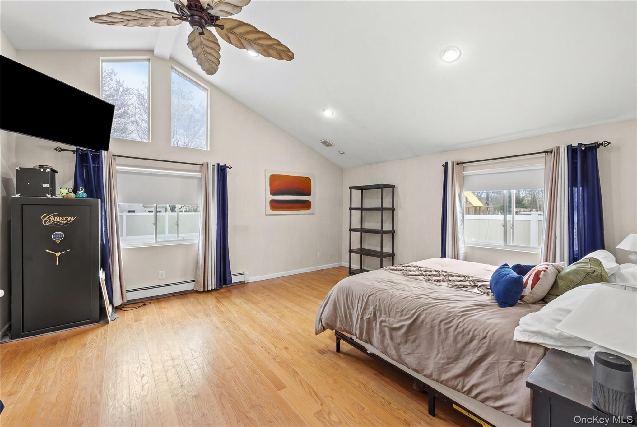 31 Halliday Road Coram, NY 11727 - Photo 11 of 30 a bedroom with a bed and a flat screen tv