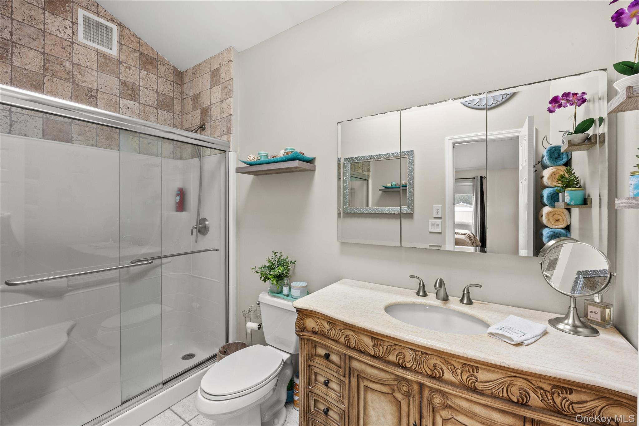 31 Halliday Road Coram, NY 11727 - Photo 13 of 30 a bathroom with a granite countertop sink vanity mirror and shower