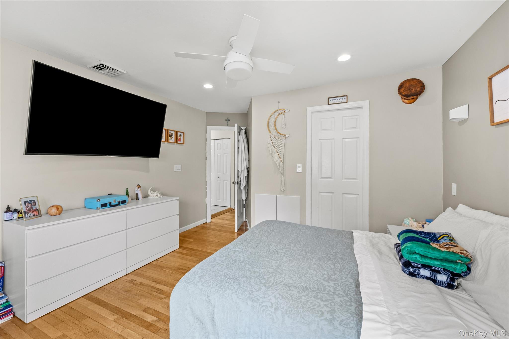 31 Halliday Road Coram, NY 11727 - Photo 15 of 30 a bedroom with a bed and a flat screen tv