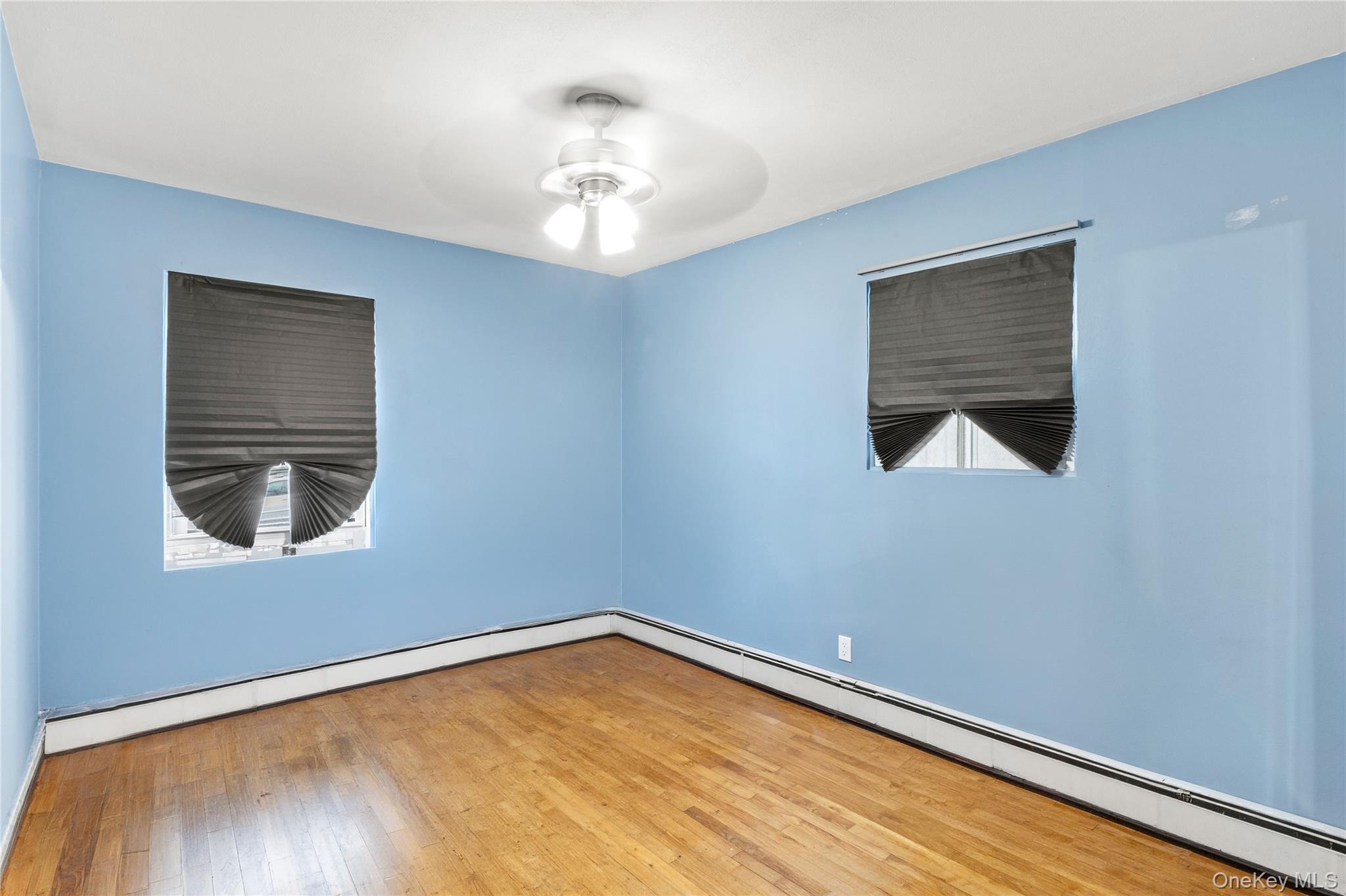 31 Halliday Road Coram, NY 11727 - Photo 19 of 30 a view of a room with a wooden floor and a window