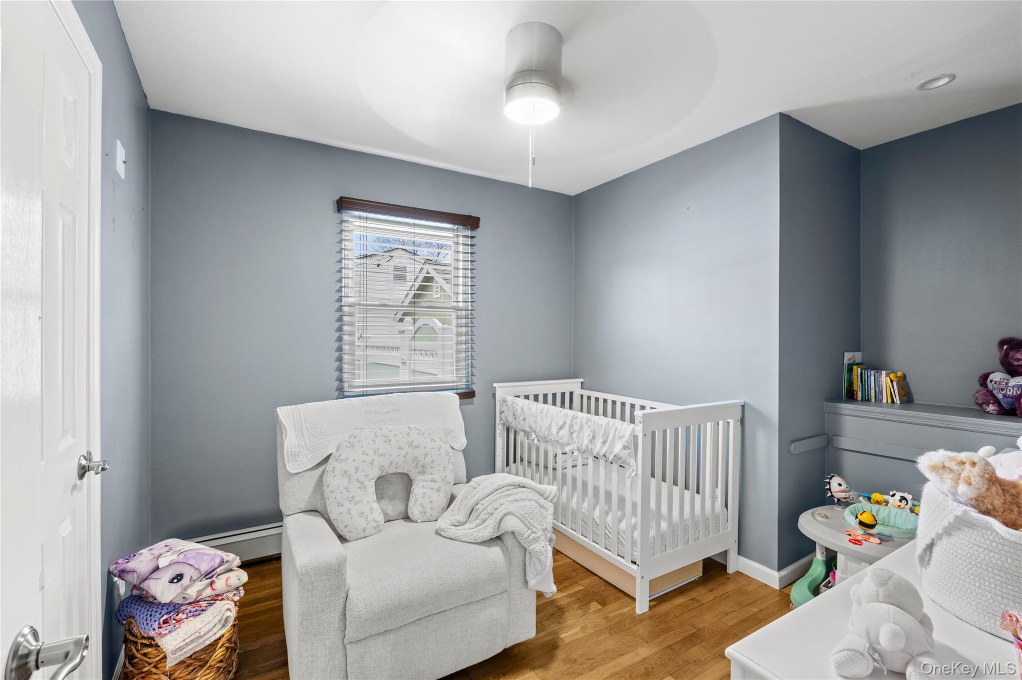 31 Halliday Road Coram, NY 11727 - Photo 20 of 30 a bed room with a bed and a window