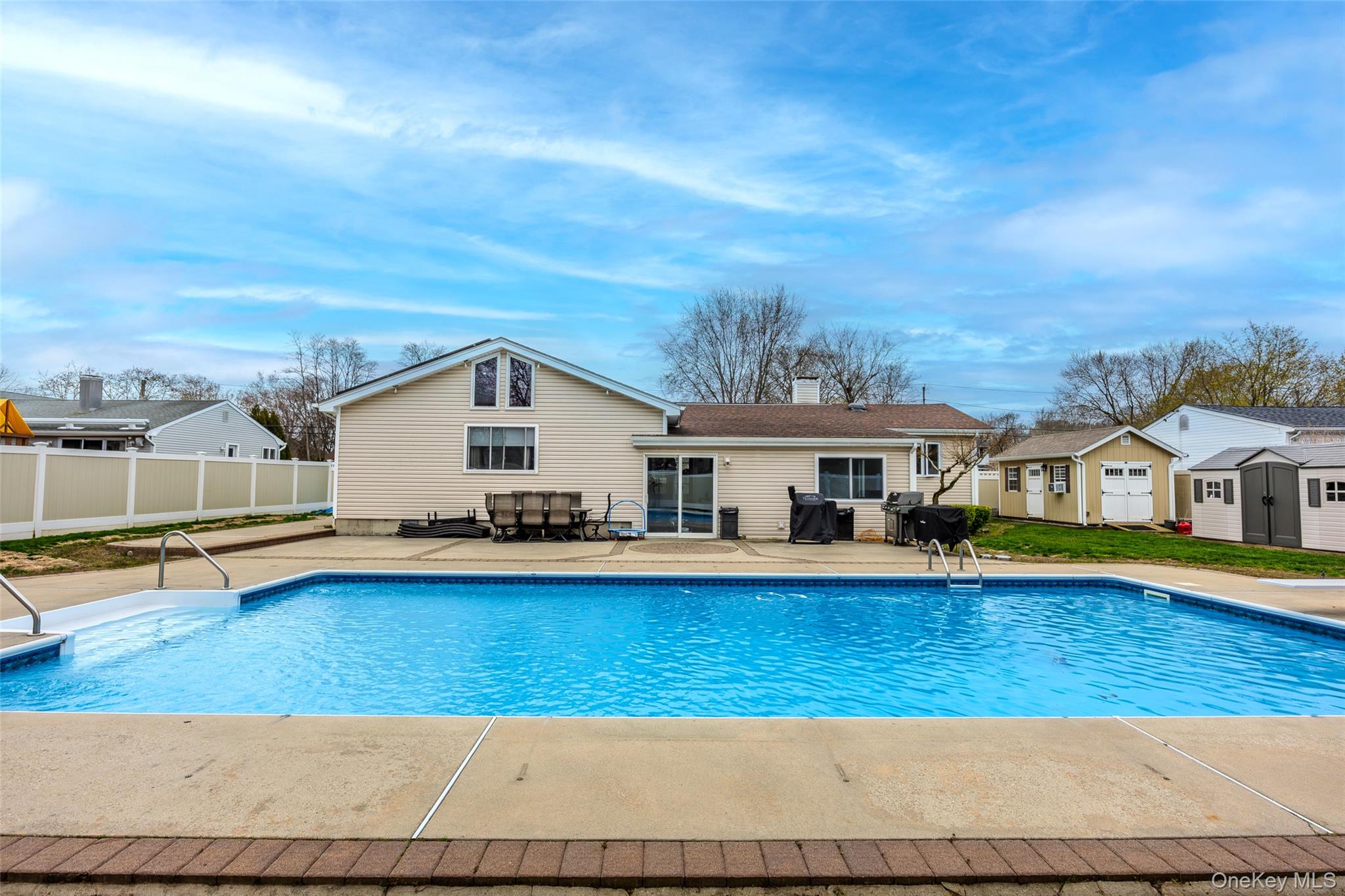31 Halliday Road Coram, NY 11727 - Photo 22 of 30 a view of a house with pool and a yard