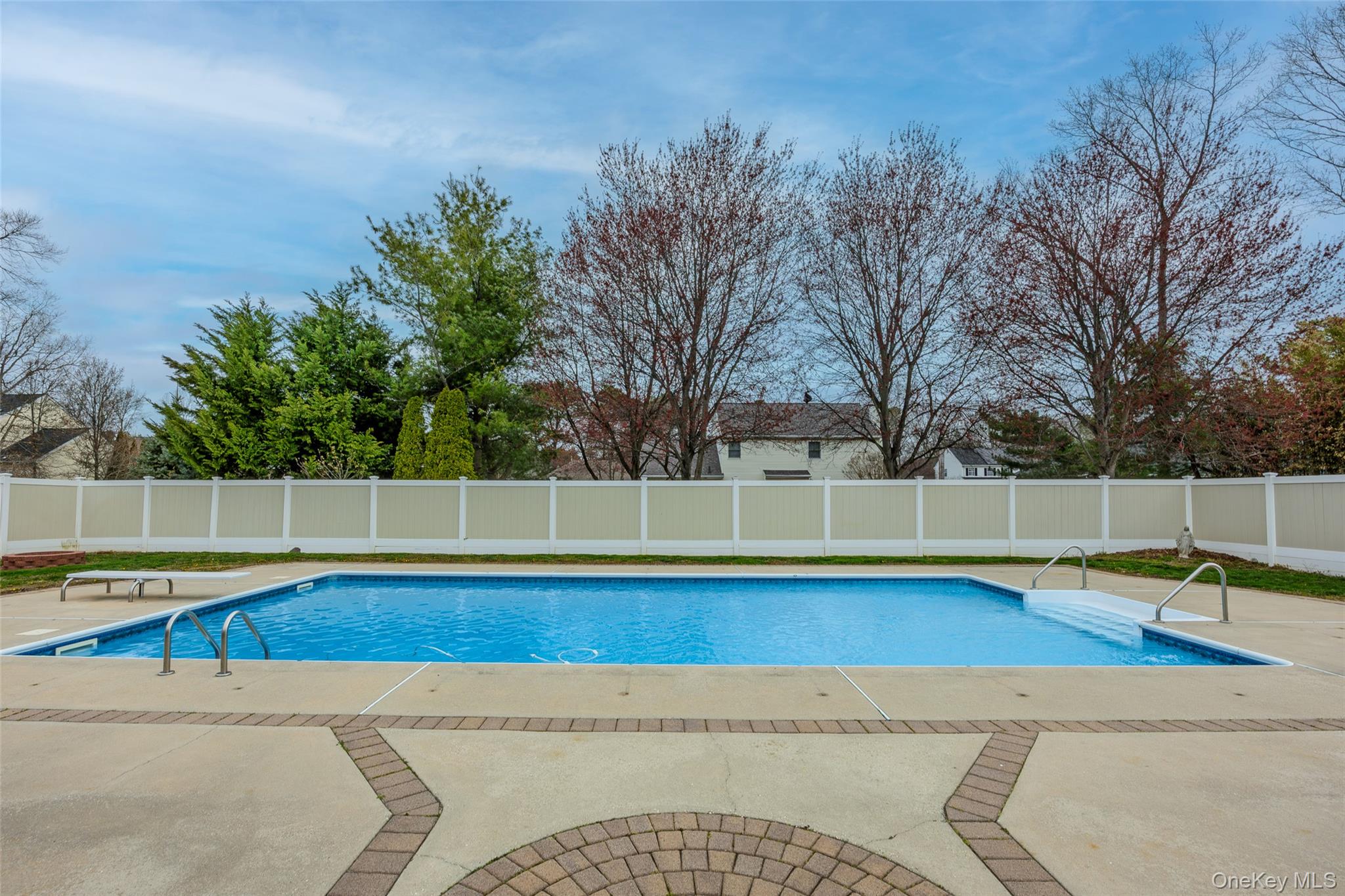 31 Halliday Road Coram, NY 11727 - Photo 23 of 30 a view of a swimming pool with an outdoor space and seating area
