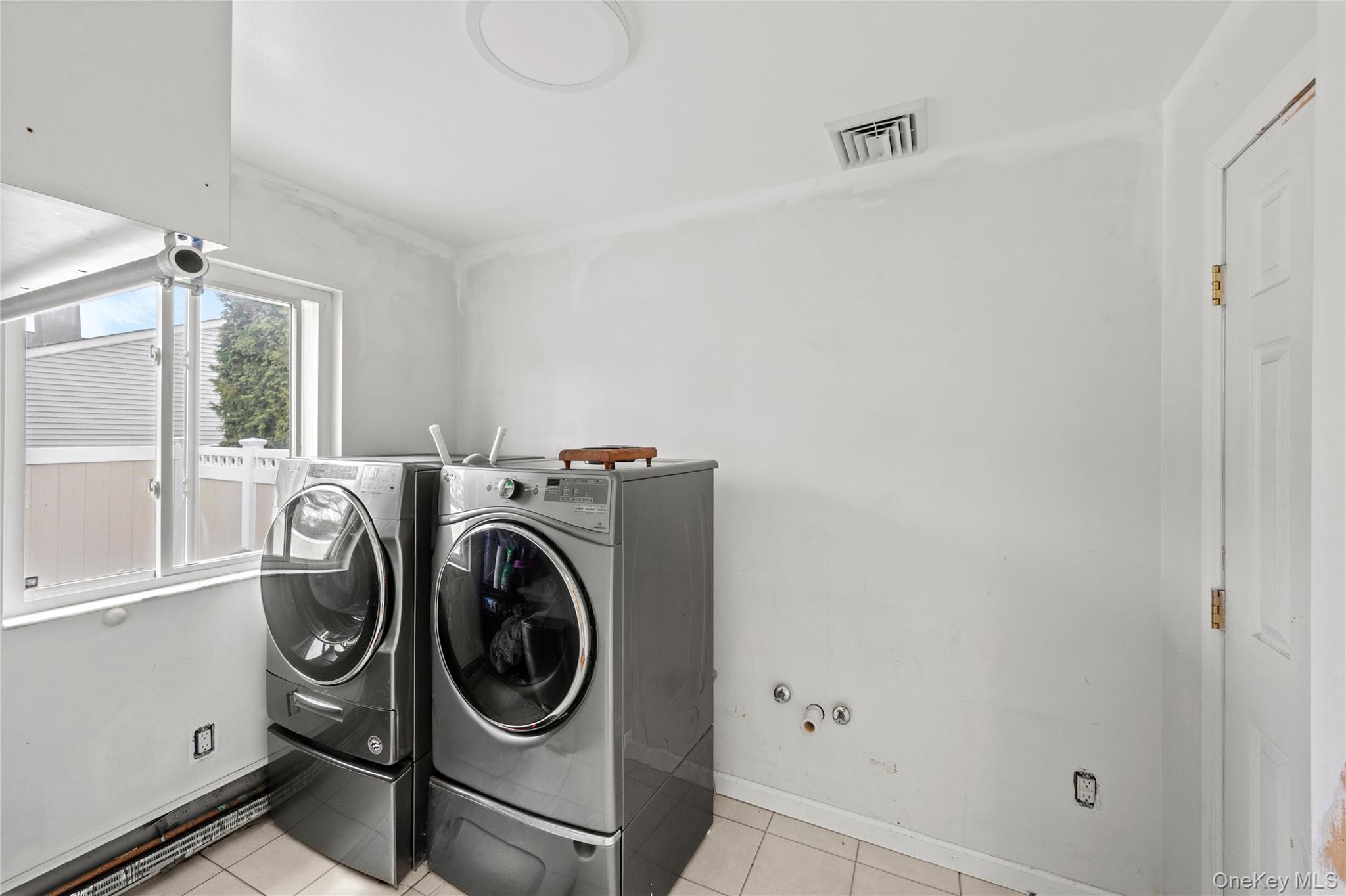 31 Halliday Road Coram, NY 11727 - Photo 30 of 30 a utility room with dryer and washer