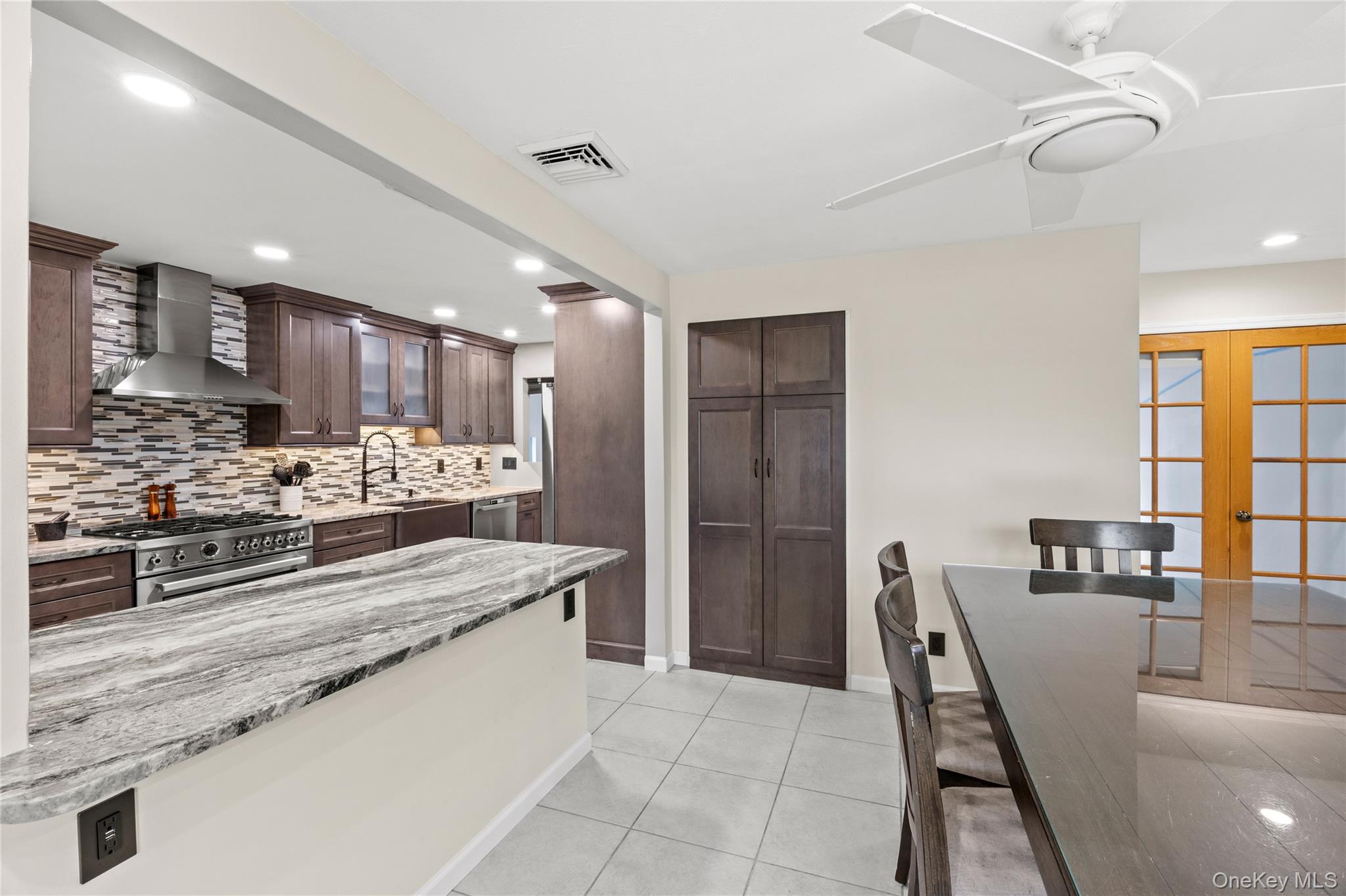 31 Halliday Road Coram, NY 11727 - Photo 4 of 30 a large kitchen with kitchen island granite countertop a large counter top appliances and cabinets