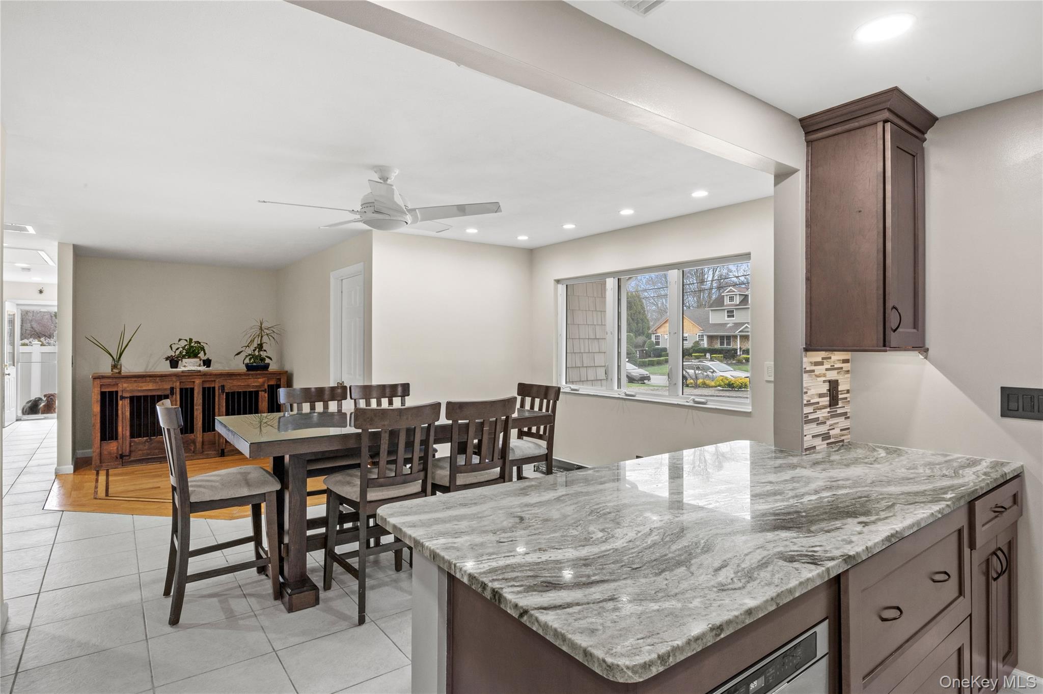 31 Halliday Road Coram, NY 11727 - Photo 5 of 30 a dining hall with stainless steel appliances granite countertop a dining table and chairs