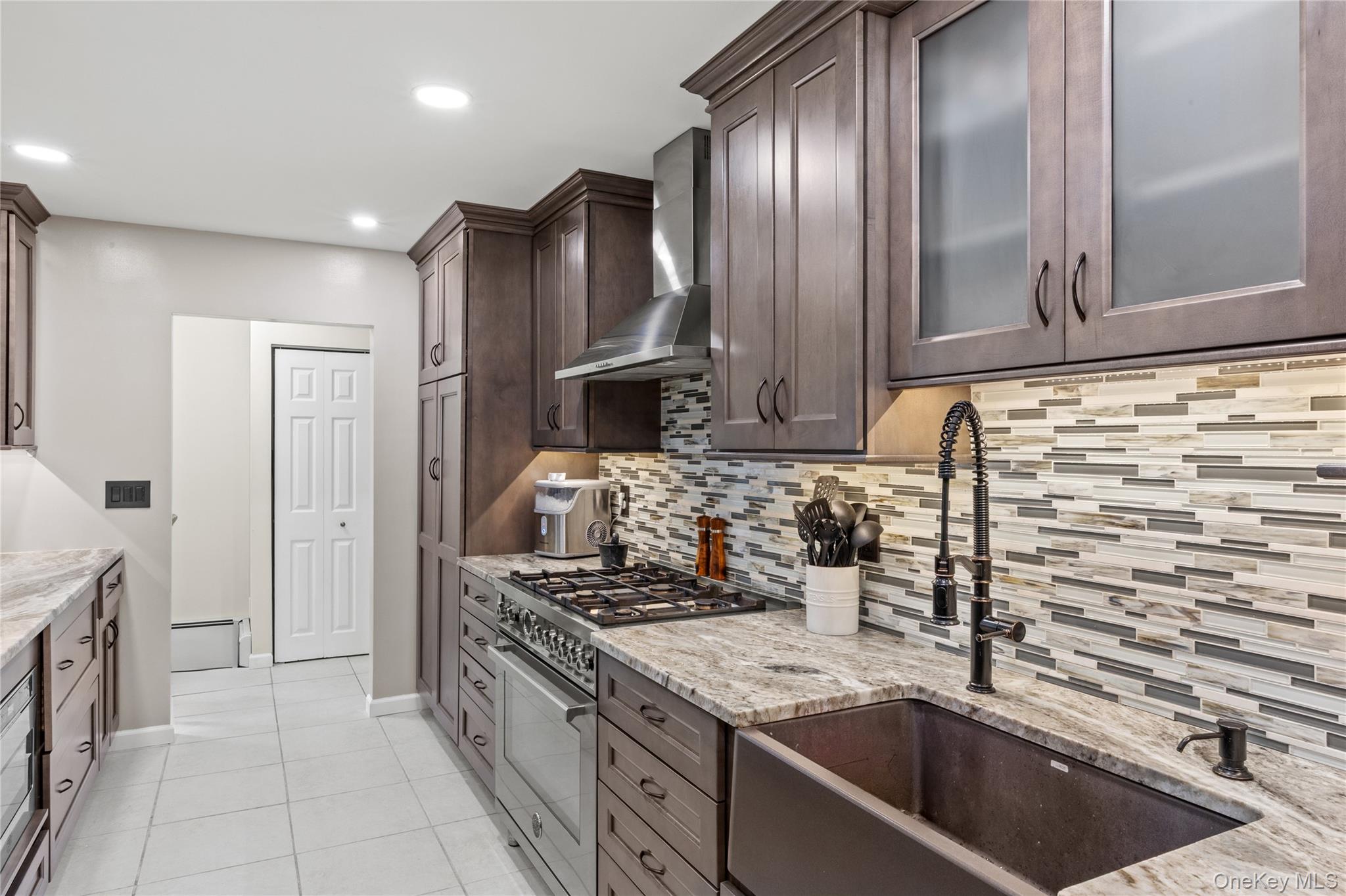 31 Halliday Road Coram, NY 11727 - Photo 6 of 30 a kitchen with stainless steel appliances granite countertop a sink stove and refrigerator