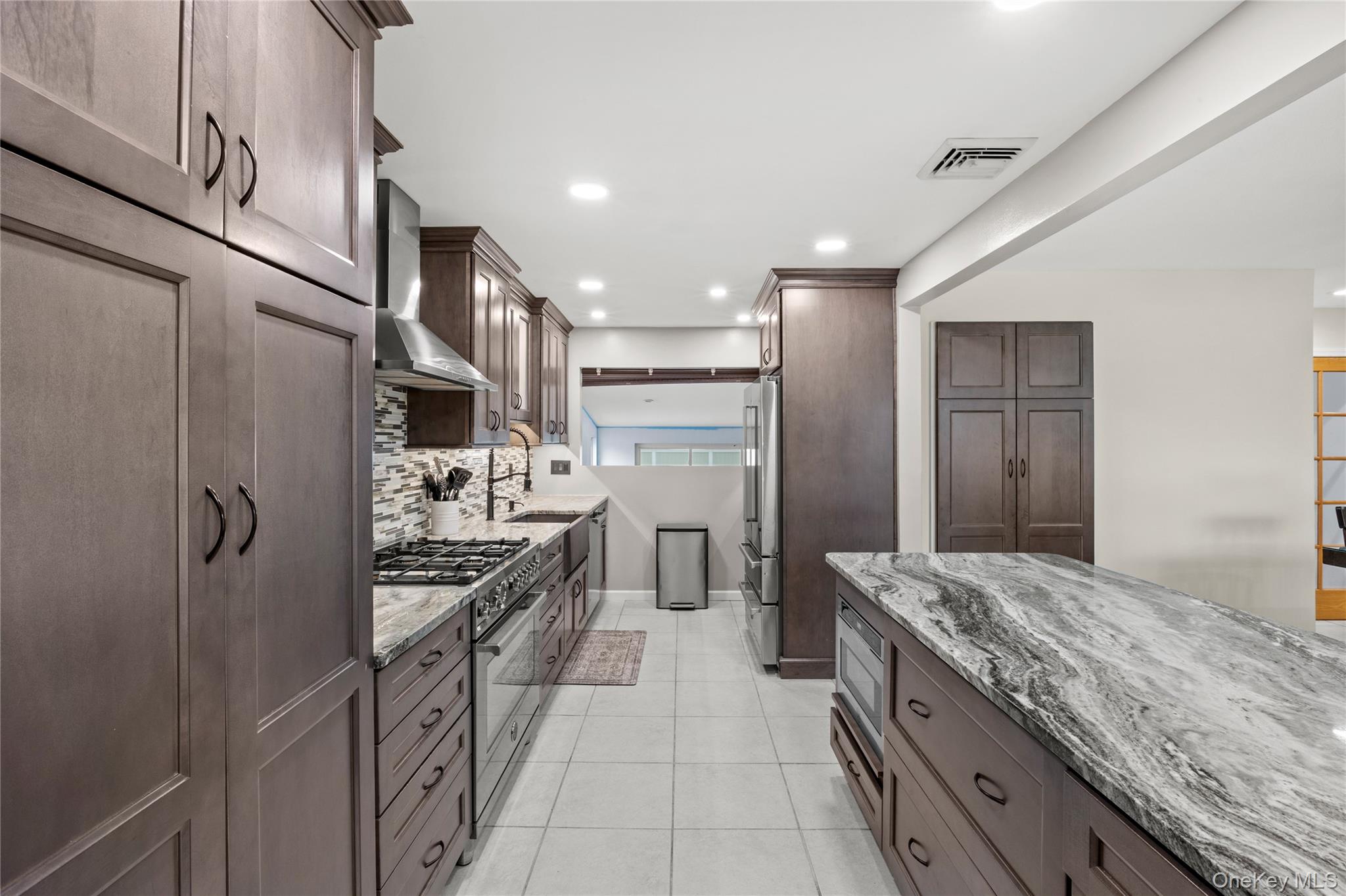 31 Halliday Road Coram, NY 11727 - Photo 7 of 30 a kitchen with stainless steel appliances granite countertop a refrigerator a stove and a sink