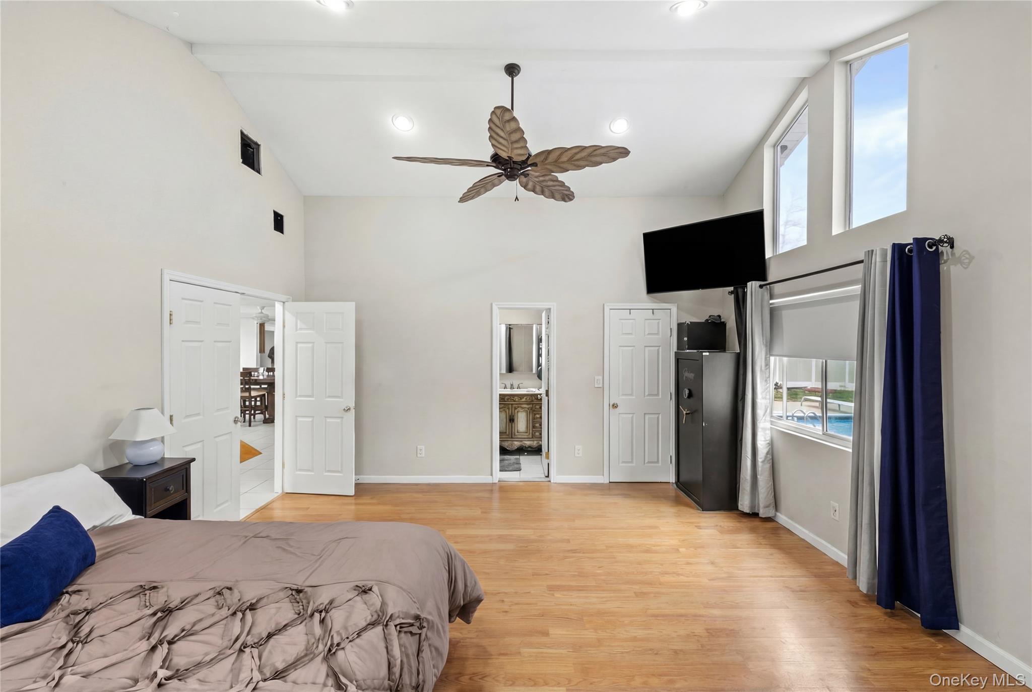 31 Halliday Road Coram, NY 11727 - Photo 10 of 30 a bedroom with a bed ceiling fan and a wooden floor
