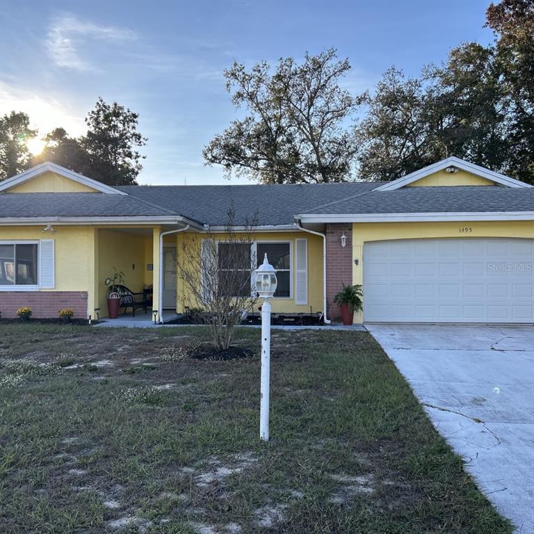 front view of a house with a yard