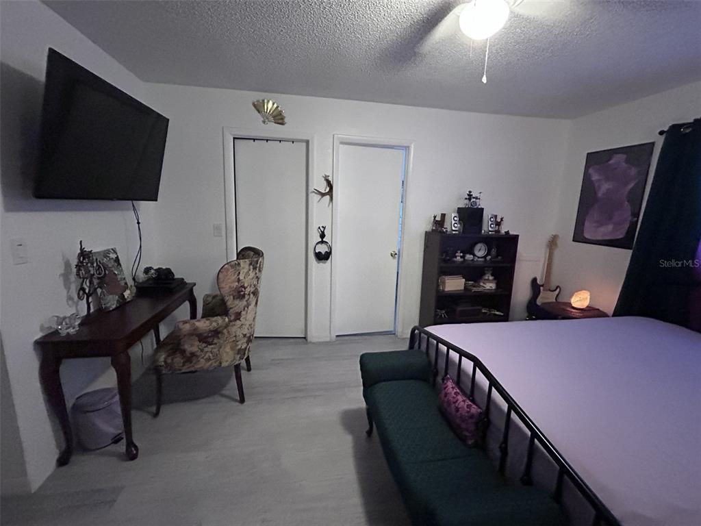 1495 Bishop Road Spring Hill, FL 34608 - Photo 19 of 34 a living room with furniture and a flat screen tv