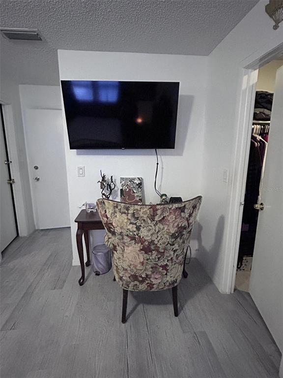 1495 Bishop Road Spring Hill, FL 34608 - Photo 21 of 34 a living room with furniture and a flat screen tv