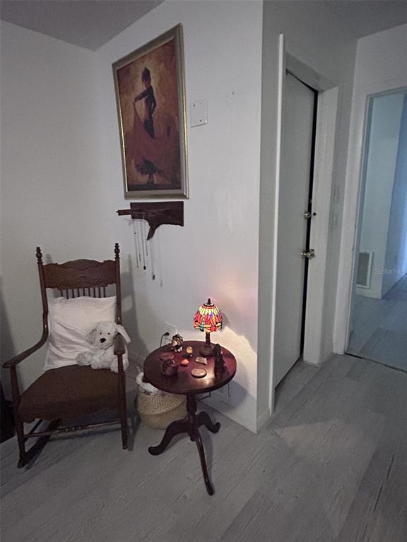 1495 Bishop Road Spring Hill, FL 34608 - Photo 22 of 34 a living room with furniture and a chair