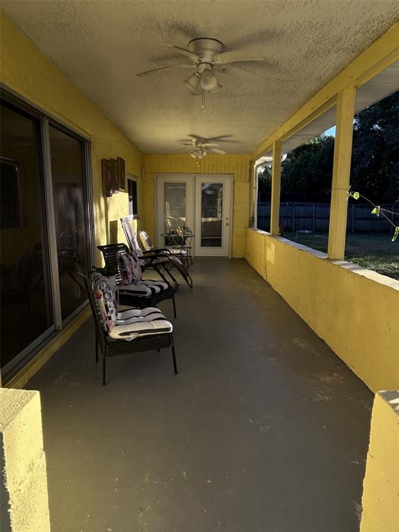 1495 Bishop Road Spring Hill, FL 34608 - Photo 27 of 34 a swimming pool with outdoor seating and yard